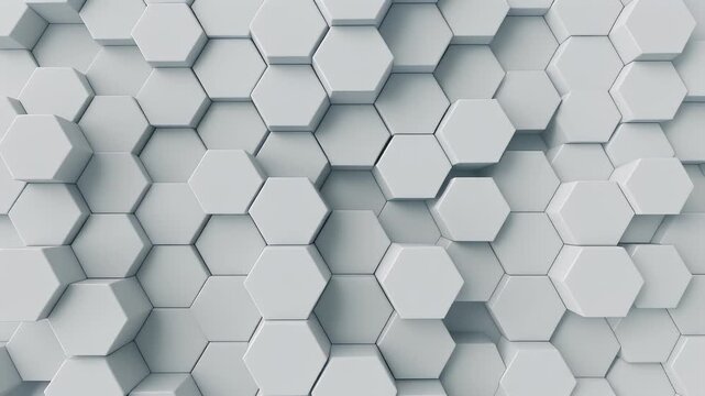 A close-up, abstract view shows a repeating pattern of white hexagonal prisms with varying heights, creating a sense of depth and texture.