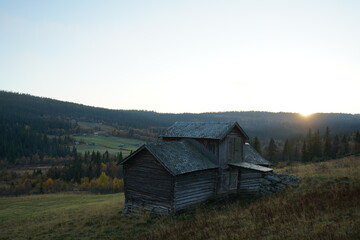 Old barn on a field, an autumn evening at sunset © TonjeMarie