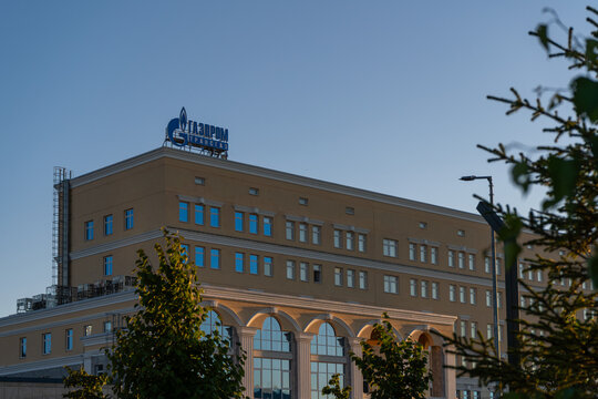 Gazprom sign above an office building in warm evening light in Ukhta, Komi Republic