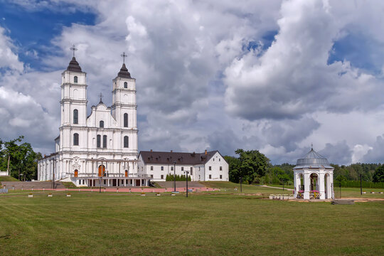 Complex view of Basilica of the Assumption in Aglona, Latvia. Daytime shot with an outdoor altar gazebo