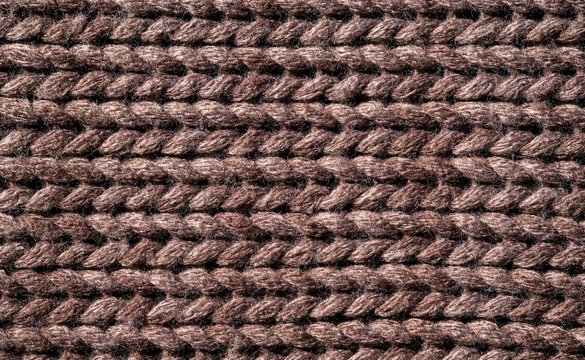 Brown knitted wool fabric close-up pattern background
