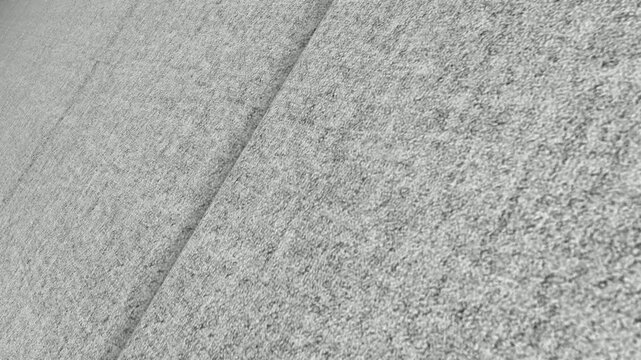 Elegant Cinematic Movement Along Italian Heather Gray Wool Cashmere Coating Fabric with Angled Perspective, Refined Lighting and Rich Textile Detail