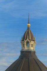 Gilded dome turret with Art Nouveau and neo-Baroque style details against a blue sky on an Antwerp Central Station roof in Belgium. © hectorchristiaen