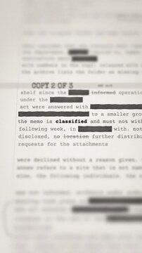 A top secret government dossier with redacted text and a red classified stamp for national security.