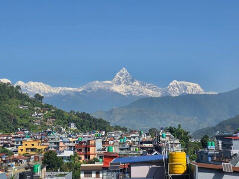 View of Pokhara city in Nepal, with the iconic Machhapuchhre (Fishtail) mountain peak rising in the background
