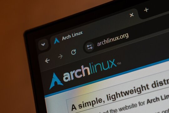 06 OCTOBER, 2026 - Tashkent, Uzbekistan: A close-up view of the Arch Linux website displayed on a computer screen, highlighting the browser tab and URL. The image captures the distinct Arch Linux logo