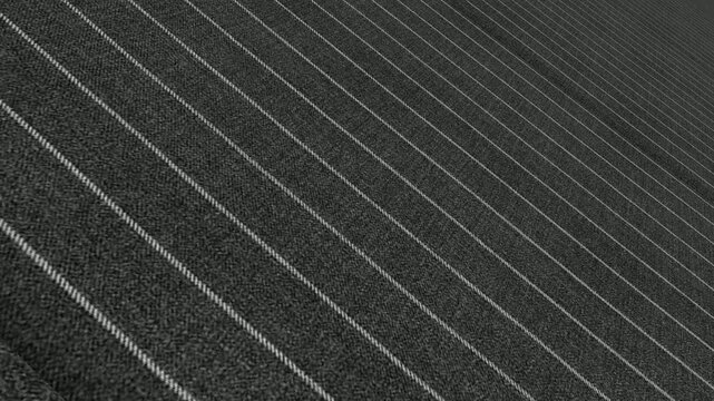 Striking Cinematic Movement Along Italian Charcoal Gray Rope Stripe Wool Fabric with Angled Perspective, Directional Lighting and Distinctive Raised Stripes