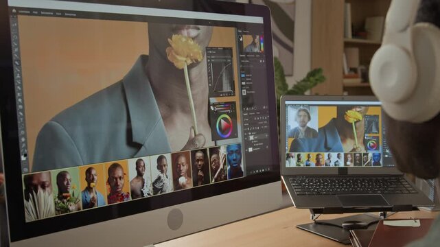 Unrecognizable African American retoucher editing portrait photos on computer monitor. Perfect for creative agency campaigns and remote post production tutorials