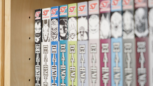 Death Note manga comic collection on bookshelf refocusing cover illustrations