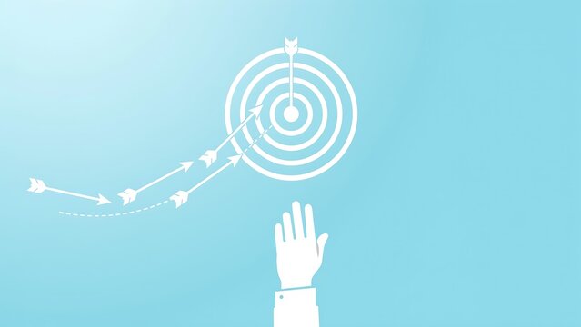 Business concept showing hand reaching for target with arrows hitting