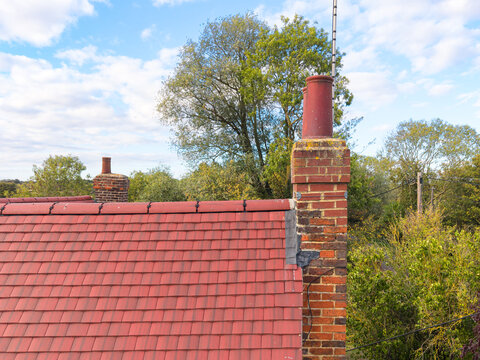 Interesting drone inspection view of a newly installed roof on an old English farm cottage in the UK. Note the very old, brick built chimney and stack which also needs to be repaired.