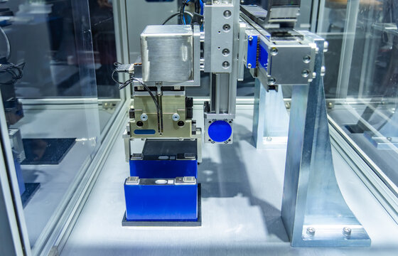 Advanced Industrial Robot Arms Assemble EV Battery Pack on Automated Production Line in Modern Electric lithium battery Smart Factory.