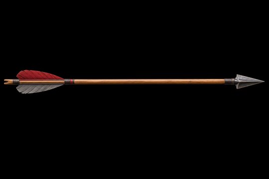 Single wooden archery arrow with sharp steel arrowhead and red gray fletching isolated against black background for bowhunting equipment catalogs