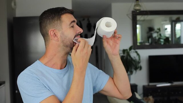 Man Eating Toilet Paper in Living Room
