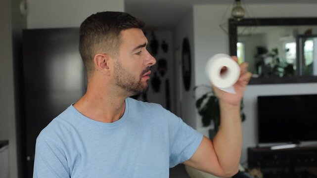 Man Eating Toilet Paper in Living Room