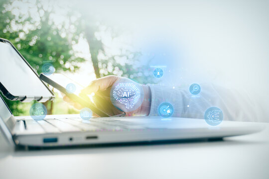 Businessman using smartphone and laptop with AI digital brain icon and connected technology business ecosystem network in outdoor setting, concept of artificial intelligence innovation.