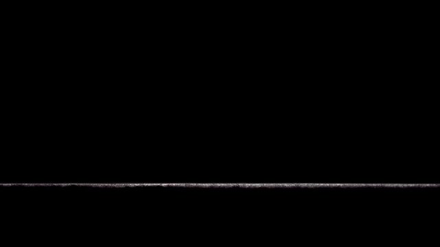 Abstract view under a hotel room door at night, dark shot through slither of carpet