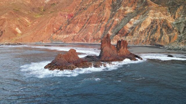 Warm late light traces the folds of the Anaga cliffs above Benijo as a lone sea stack sits offshore. A calmer moment before the sun drops fully into the Atlantic.