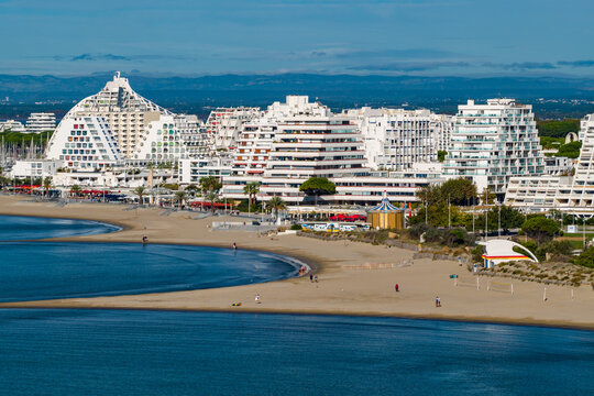 Aerial view of La Grande-Motte pyramidal architecture and Mediterranean coastline in south France 