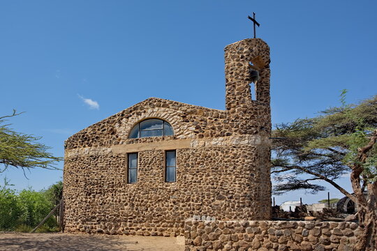 Kenya, Marsabit. June 18, 2026. The architecture of the Catholic church and its courtyard, with space for numerous parishioners in the city center on stone sand.