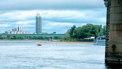 Moored Boats Beside Urban River Waterfront © YuliiaMazurkevych