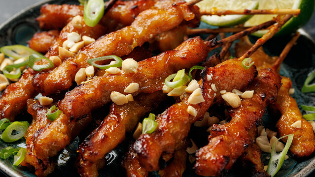 Grilled Chicken Satay Skewers with Peanuts, Spring Onions and Lime