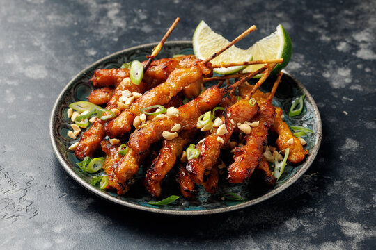 Grilled Chicken Satay Skewers with Peanuts, Spring Onions and Lime