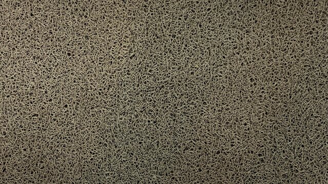 Close-Up High-Definition Texture of Durable Grey Synthetic Coil Doormat Material for Industrial and Home Use Backgrounds