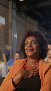 African American woman singing passionately during Christian evangelical gathering expressing faith worship gratitude and emotional spiritual connection in church atmosphere