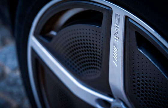 Mercedes-AMG aerodynamic alloy wheel rim with embossed logo illustrating modern high-performance electric automotive design and luxury engineering