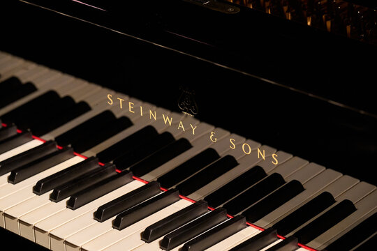 Detailed close-up of a Steinway and Sons grand piano keyboard and logo in Rybnik, Poland