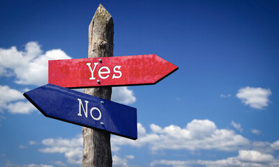 Yes or no - wooden signpost with two arrows, sky with clouds © PX Media
