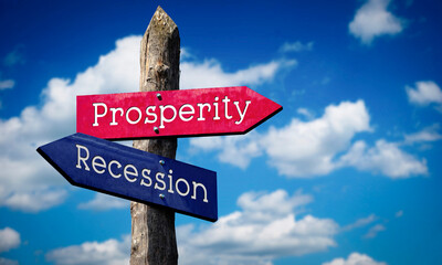 Prosperity or recession - wooden signpost with two arrows, sky with clouds © PX Media