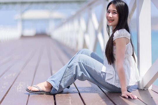 Young Woman Relaxing by the Beach on Koh Si Chang Island, Thailand