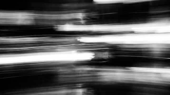 Abstract blurred motion of city lights at night creating a dynamic and energetic urban atmosphere