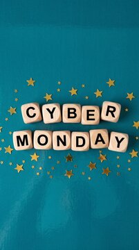 CYBER MONDAY spelled out in block letters on a teal background with golden stars