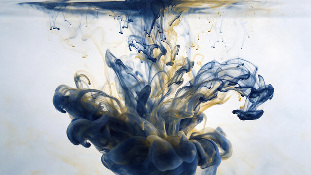 Blue and gold ink swirling and dissolving in clear water
