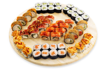 Assorted sushi platter arranged on a round wooden serving board with rolls, salmon, avocado, sesame coating, and grilled toppings, isolated food assortment © Кирилл Горшков