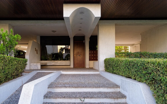 commercial real estate photograph of a modern residential apartment building entrance in Athens, ideal for property listings and architectural features.