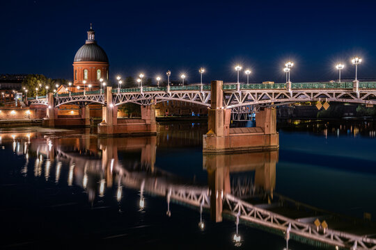 Toulouse, France - The illuminated Saint-Pierre Bridge and the Dome de la Grave in Toulouse at night