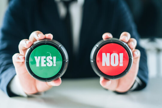 businessperson show  green or red button to make yes or no decision symbolizing choice voting approval and rejection in business finance and law Concept.