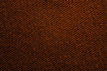 Fototapeta premium A close-up shot of a textured brown fabric with a distinct woven diagonal pattern.