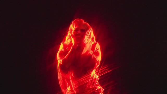 Flamboyant drag queen dancing and performing on stage