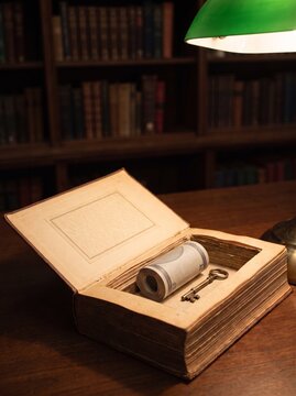Roll Of Money And Old Key Hidden In Hollowed Book