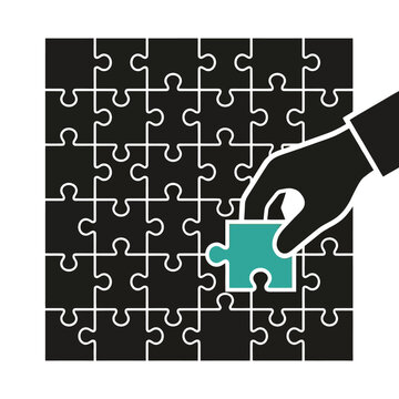 Black puzzle pieces vector illustration with human hand placing turquoise final piece correctly