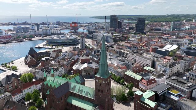 Aerial view of the historic Aarhus Cathedral and Aarhus harbor on a sunny day, Denmark.	