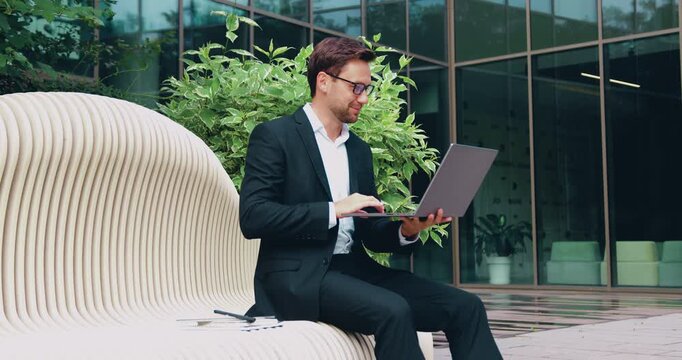 Close-up of an adult businessman joining a virtual meeting during an important online video call on a laptop. Remote communication, virtual meeting, digital business interaction