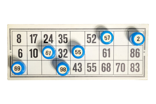 bingo card numbers with markers showing winning pattern in progress play