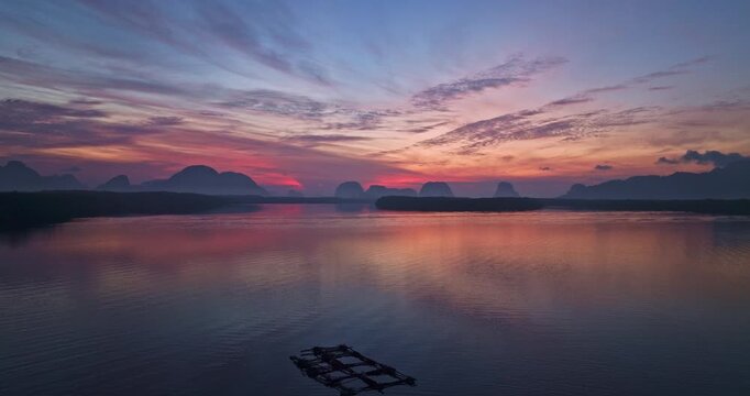 
time lapse amazing sky at twilight above Ban Sam Chong  fishing village
time lapse Panoramic sunrise Landscape above Baan Sam Chong village in Phang Nga Bay