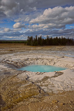 Opal Pool half-filled with turquoise-blue water, completely drained in 2005 and refilled from 2008 on. Midway Geyser Basin-Yellowstone NP-WY-USA-034